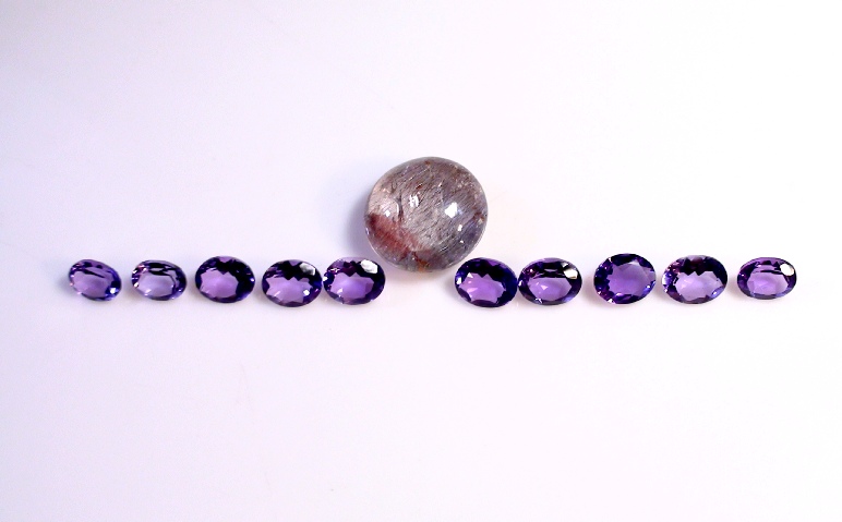 Apart of the 50 caret Faceted Amethyst Gemstone Lot.